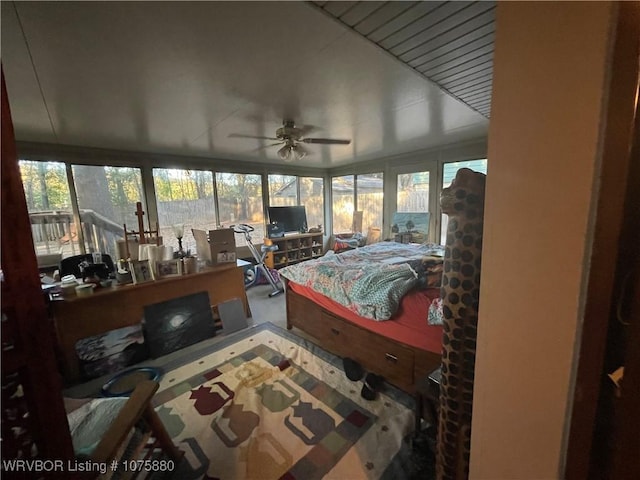 bedroom featuring ceiling fan and carpet floors