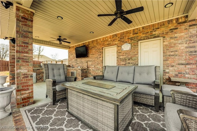 view of patio / terrace with an outdoor hangout area, ceiling fan, and fence