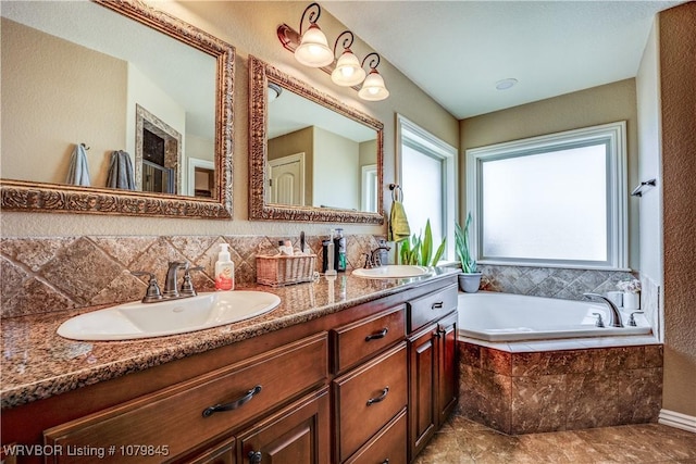 full bath featuring double vanity, a sink, and a garden tub