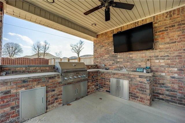 view of patio featuring a fenced backyard, area for grilling, a grill, and ceiling fan