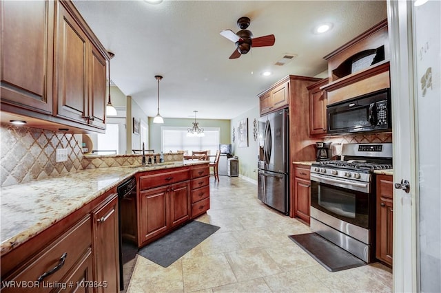 kitchen with backsplash, a peninsula, ceiling fan with notable chandelier, visible vents, and black appliances