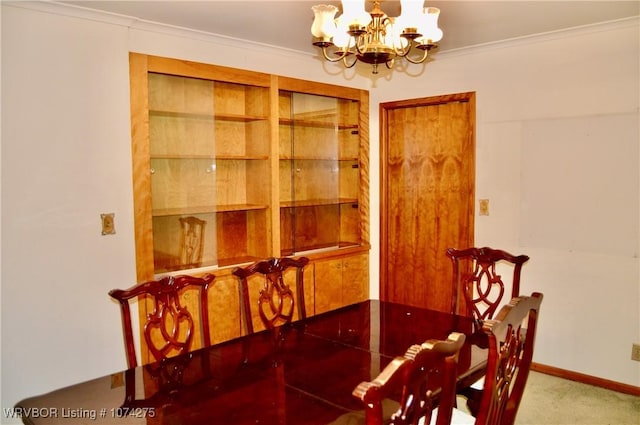 dining space featuring a notable chandelier, carpet floors, and ornamental molding