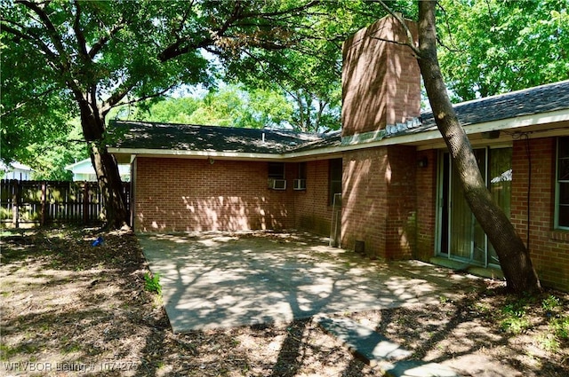 back of property with a patio area