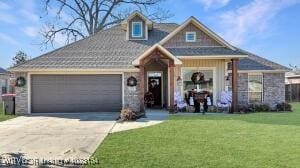 view of front of house featuring a garage, concrete driveway, and a front yard