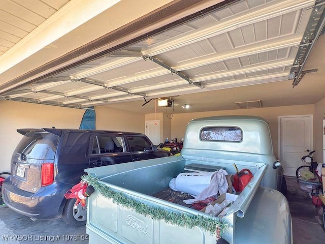 garage featuring a garage door opener