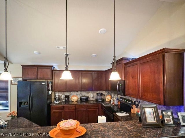 kitchen featuring decorative light fixtures, dark countertops, visible vents, backsplash, and black appliances