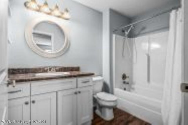 bathroom with  shower combination, vanity, and toilet