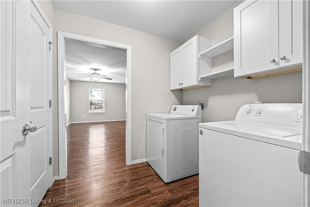 washroom featuring dark wood finished floors, cabinet space, ceiling fan, a textured ceiling, and washer and dryer