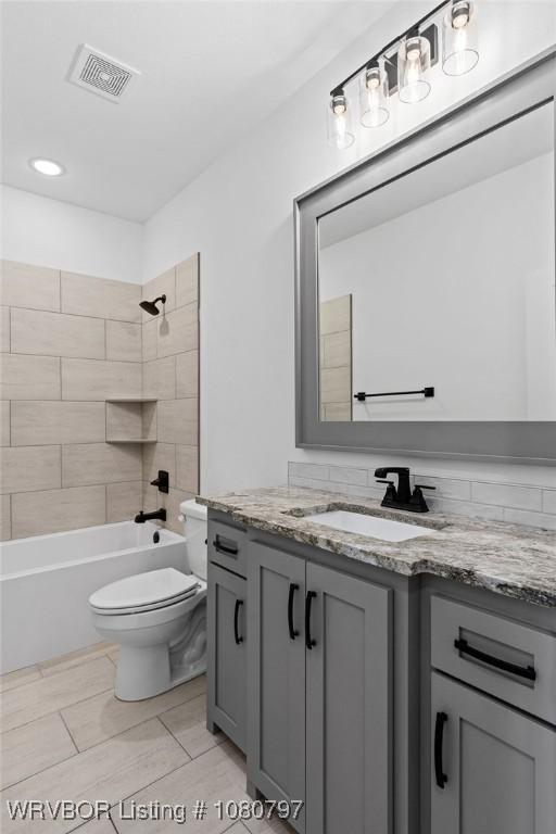1317 Big Oak Dr, Alma, AR 72921 - full bathroom featuring shower / bathing tub combination, vanity, toilet, and visible vents