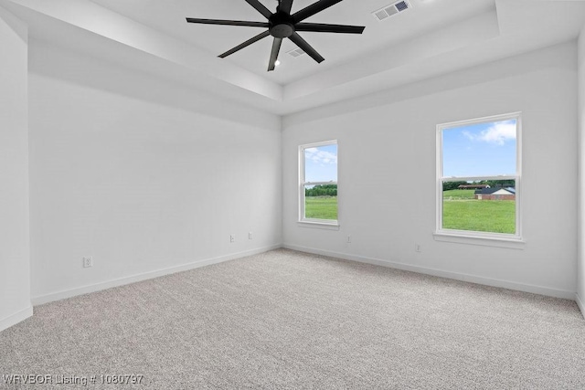 1317 Big Oak Dr, Alma, AR 72921 - carpeted spare room with baseboards, a raised ceiling, ceiling fan, and visible vents