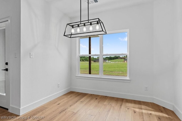 1317 Big Oak Dr, Alma, AR 72921 - unfurnished dining area with visible vents, baseboards, a notable chandelier, and light wood-style floors