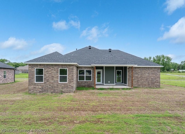 1317 Big Oak Dr, Alma, AR 72921 - rear view of property featuring a lawn, a patio area, and brick siding