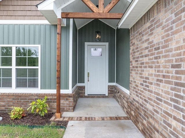 1317 Big Oak Dr, Alma, AR 72921 - doorway to property with board and batten siding and brick siding