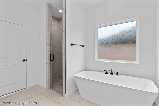 1317 Big Oak Dr, Alma, AR 72921 - full bath with a freestanding bath, baseboards, and a shower stall