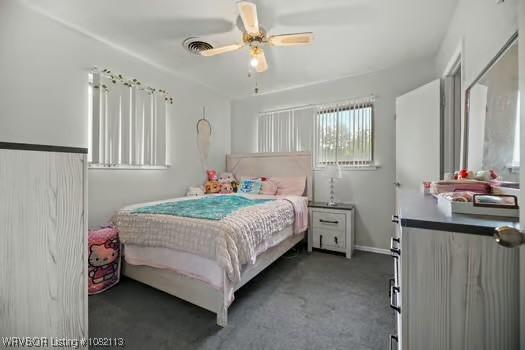 204 Cornell Ave, Fort Smith, AR 72908 - carpeted bedroom with a ceiling fan and baseboards