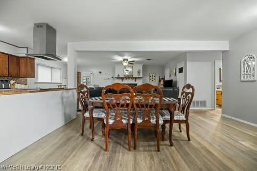 204 Cornell Ave, Fort Smith, AR 72908 - dining room featuring light wood finished floors and a ceiling fan