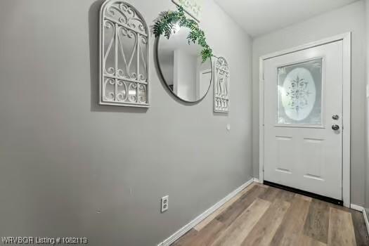 204 Cornell Ave, Fort Smith, AR 72908 - foyer entrance featuring wood finished floors and baseboards