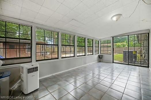 204 Cornell Ave, Fort Smith, AR 72908 - unfurnished sunroom with plenty of natural light and tile patterned floors