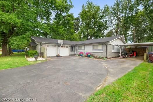204 Cornell Ave, Fort Smith, AR 72908 - single story home with asphalt driveway, a garage, a front lawn, and a carport