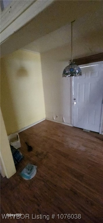 unfurnished dining area featuring hardwood / wood-style floors