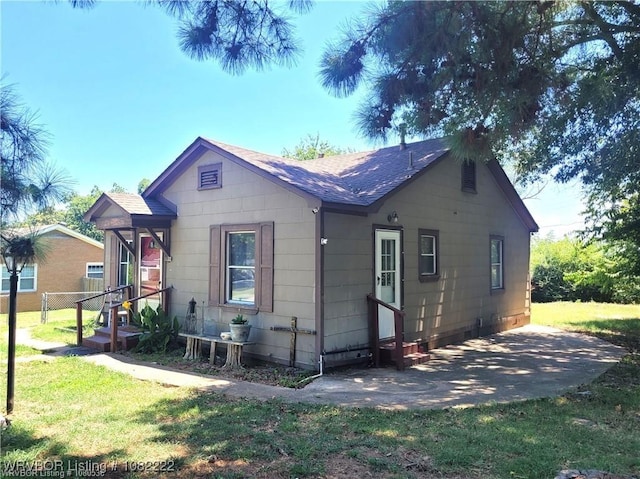 1100 Dechard St, Van Buren, AR 72956 - rear view of property featuring roof with shingles, entry steps, and a patio