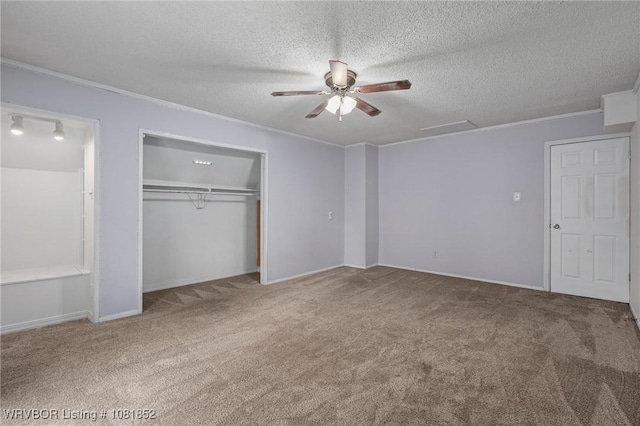 3232 Edinburgh Dr, Fort Smith, AR 72908 - unfurnished bedroom featuring carpet, a closet, a textured ceiling, ornamental molding, and attic access