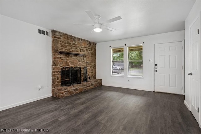 3232 Edinburgh Dr, Fort Smith, AR 72908 - unfurnished living room featuring ceiling fan, a stone fireplace, and dark wood finished floors