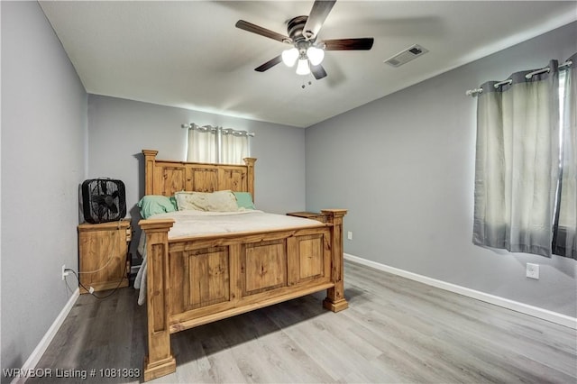 614 12th St, Van Buren, AR 72956 - bedroom featuring light wood-type flooring, baseboards, and ceiling fan