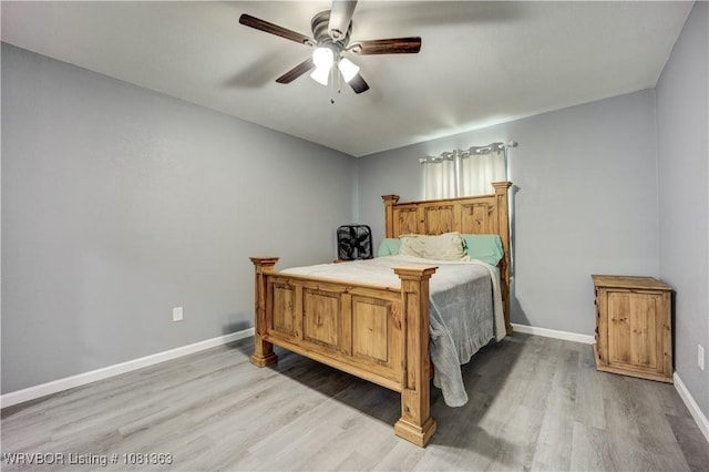 614 12th St, Van Buren, AR 72956 - bedroom with light wood-style floors, baseboards, and ceiling fan