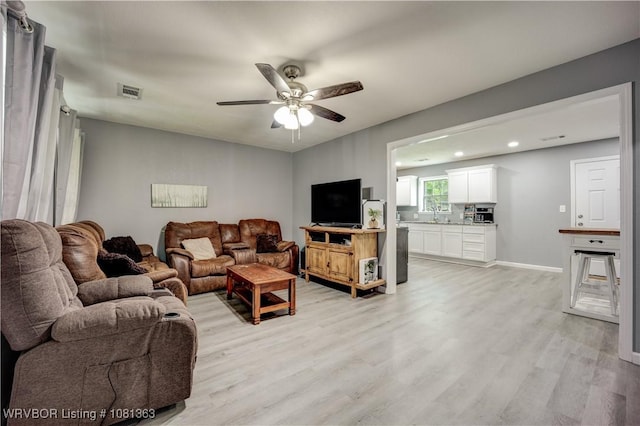 614 12th St, Van Buren, AR 72956 - living area with light wood-style floors, ceiling fan, recessed lighting, and baseboards