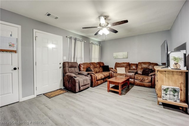 614 12th St, Van Buren, AR 72956 - living room featuring light wood finished floors and a ceiling fan