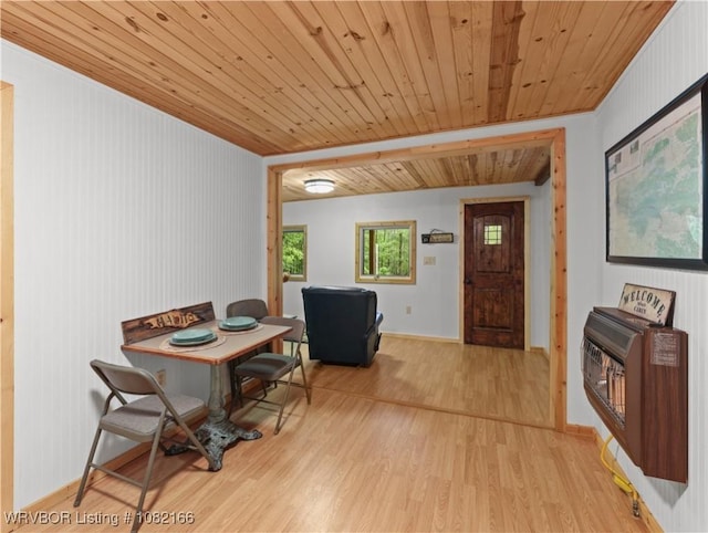 33971 Holson Valley Rd, Wister, OK 74966 - dining space with wooden ceiling, heating unit, and light wood-type flooring
