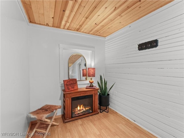 33971 Holson Valley Rd, Wister, OK 74966 - hall with light wood-style flooring, wooden ceiling, and wood walls