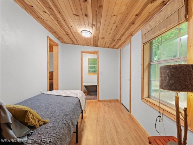 33971 Holson Valley Rd, Wister, OK 74966 - bedroom with light wood-style flooring and wood ceiling