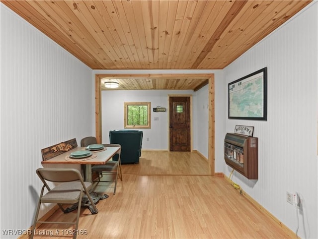 33971 Holson Valley Rd, Wister, OK 74966 - dining room with heating unit, light wood-type flooring, and wood ceiling