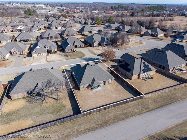 birds eye view of property with a residential view