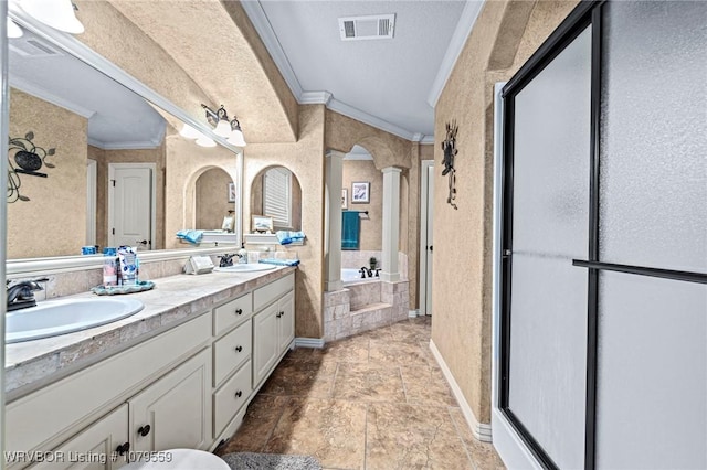 full bath with crown molding, visible vents, ornate columns, and a sink