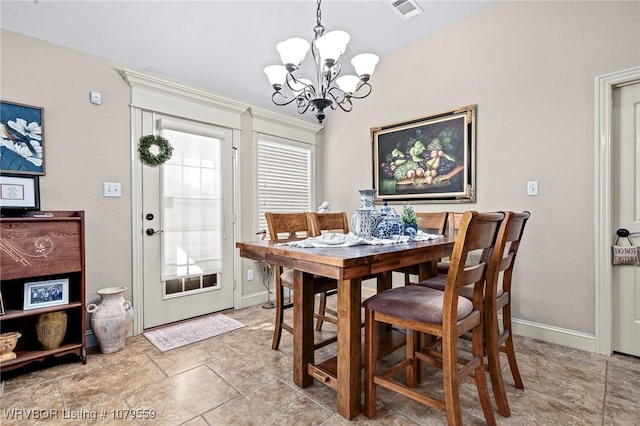 dining space featuring visible vents, baseboards, and an inviting chandelier