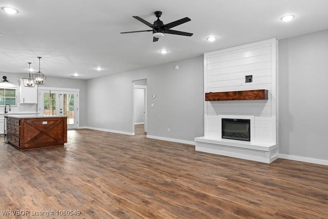 8208 Shaver Rd, Lavaca, AR 72941 - unfurnished living room featuring baseboards, recessed lighting, a fireplace, dark wood-type flooring, and a ceiling fan