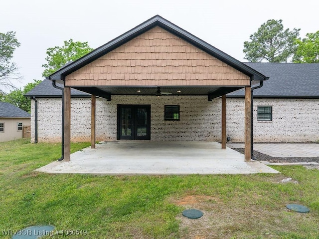 8208 Shaver Rd, Lavaca, AR 72941 - back of property with a patio, a lawn, a carport, brick siding, and french doors