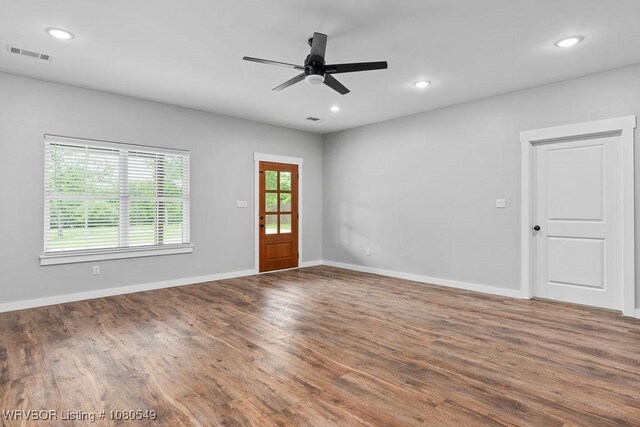 8208 Shaver Rd, Lavaca, AR 72941 - unfurnished room featuring wood finished floors, visible vents, and baseboards