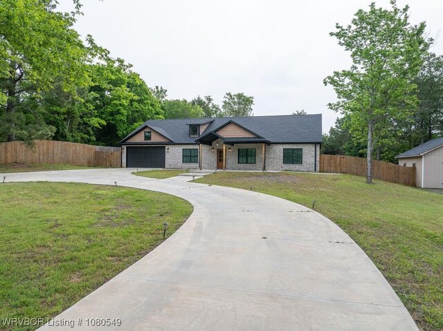 8208 Shaver Rd, Lavaca, AR 72941 - view of front of house with concrete driveway, a front yard, and fence