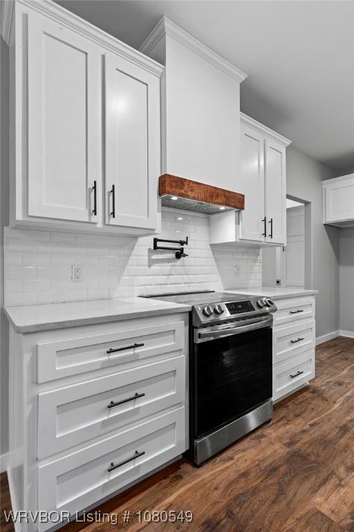8208 Shaver Rd, Lavaca, AR 72941 - kitchen with light countertops, white cabinets, decorative backsplash, and stainless steel range with electric cooktop