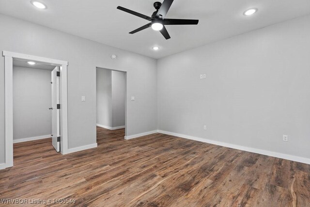 8208 Shaver Rd, Lavaca, AR 72941 - unfurnished bedroom featuring baseboards, recessed lighting, and wood finished floors