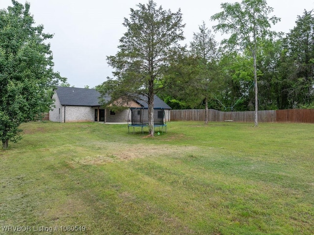 8208 Shaver Rd, Lavaca, AR 72941 - view of yard featuring a trampoline and fence private yard