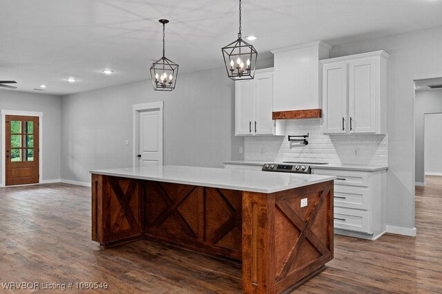 8208 Shaver Rd, Lavaca, AR 72941 - kitchen featuring a center island, dark wood-style floors, and baseboards