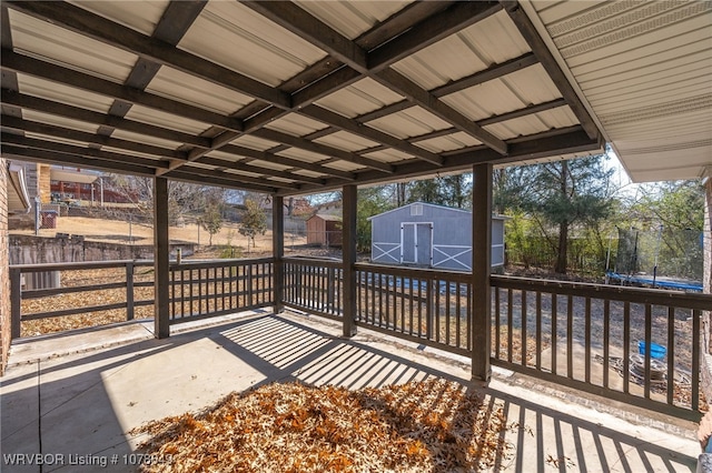 wooden terrace with an outbuilding