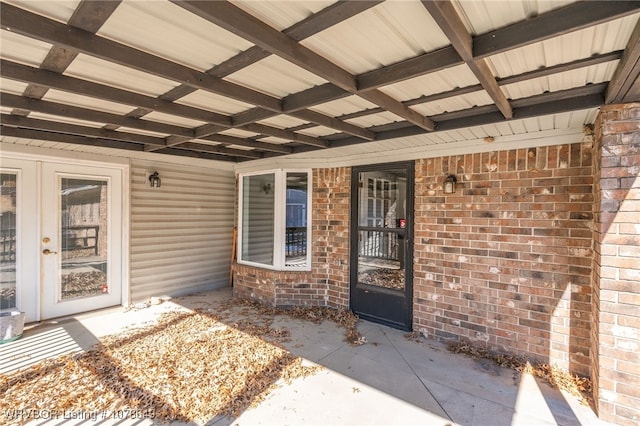 entrance to property featuring a patio