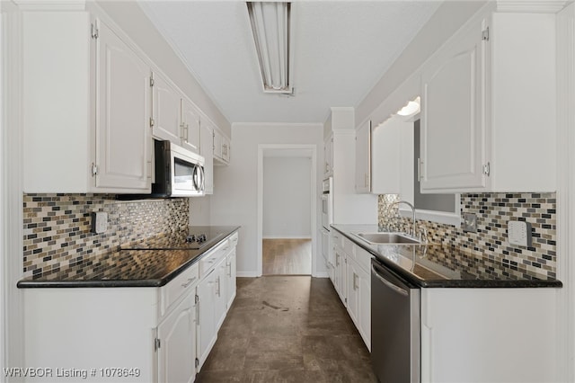 kitchen featuring sink, stainless steel appliances, and white cabinets