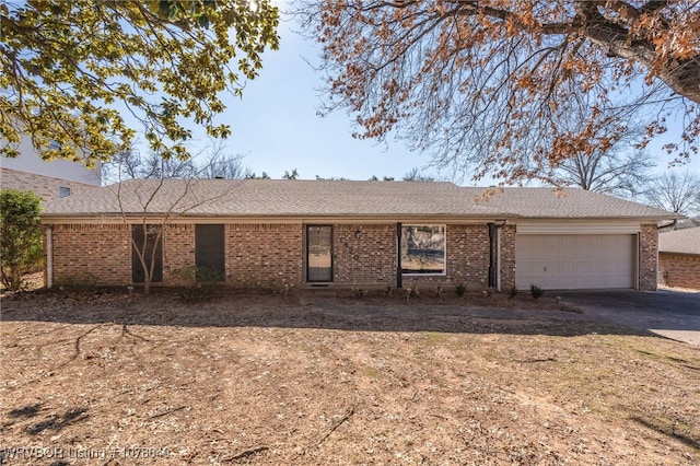 ranch-style home featuring a garage